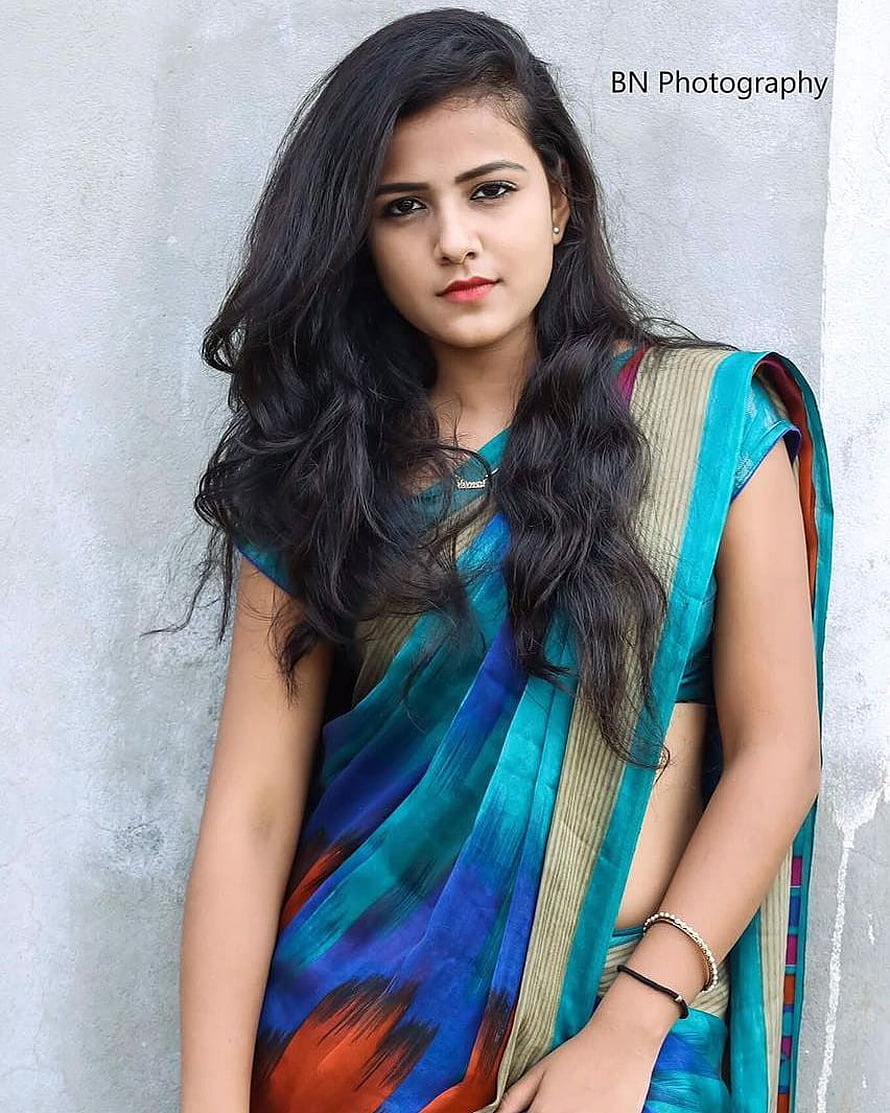 Vaishnavi Chaitanya in a vibrant teal and blue sari with a gold border HD phone wallpaper