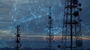 Telecommunications Network Towers with Digital Connectivity Overlay at Dusk HD wallpaper