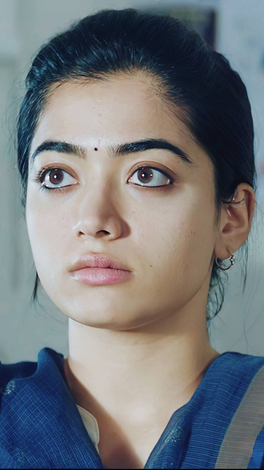 Portrait of a woman with a bindi wearing a blue saree looking upwards with a serious expression, Rashmika mandanna, telugu actress, gorgeous HD phone wallpaper