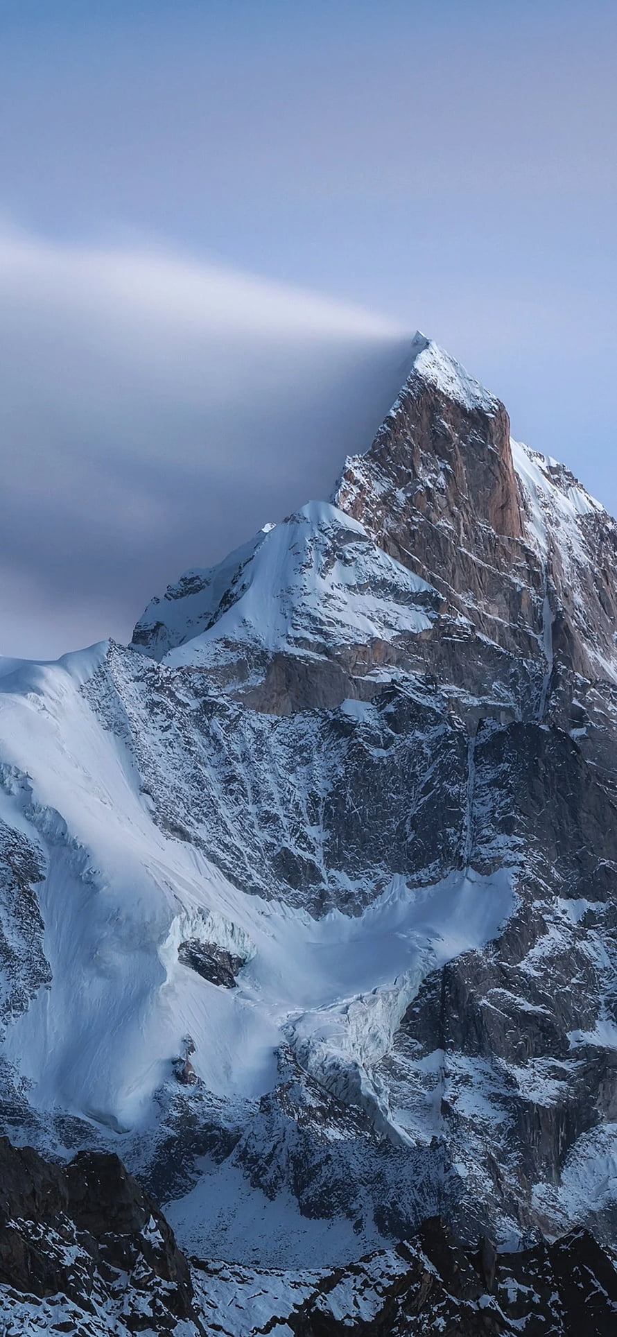 Majestic Snow-Capped Mountain Peak with Dramatic Clouds and Rugged Rocky Terrain HD phone wallpaper