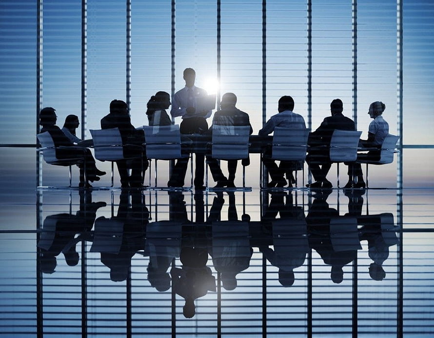 Silhouettes of business team meeting in modern office with reflective floor HD wallpaper