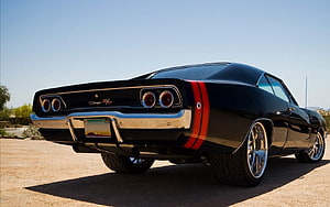Black 1968 Dodge Charger R/T Rear Three-Quarter View with Red Stripes and Chrome Wheels HD wallpaper