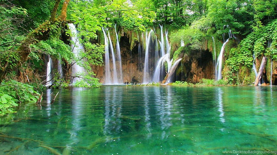 Crystal Clear Turquoise Waterfall Cascading Into A Serene Forest Lake HD wallpaper