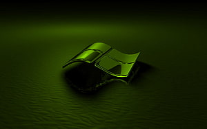 Glossy Green Windows Logo on Dark Textured Surface with Reflection HD wallpaper
