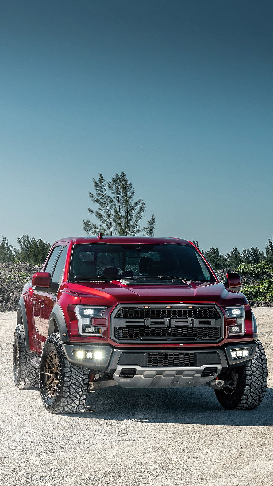 Red Ford F-150 Raptor Off-Road Truck With Aggressive Front Grille And LED Lighting HD phone wallpaper