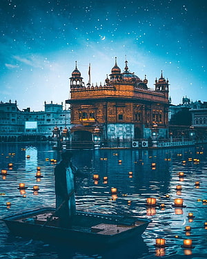 Golden Temple Amritsar at Night with Floating Diyas and Starry Sky HD phone wallpaper