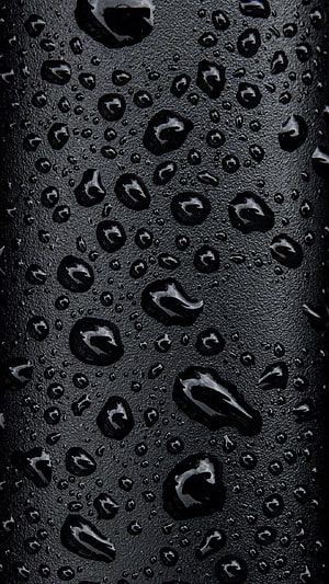 Dark Macro Photography of Water Droplets on a Textured Black Surface HD phone wallpaper