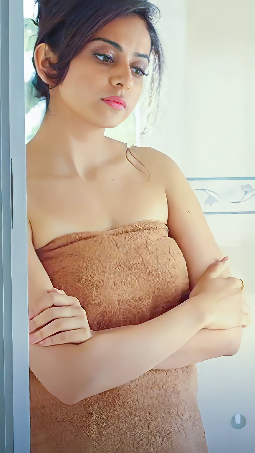Rakul Preet Singh wrapped in a brown towel looking over her shoulder HD phone wallpaper