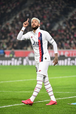 Neymar Jr. in Paris Saint-Germain white away kit pointing to the sky during a match HD phone wallpaper