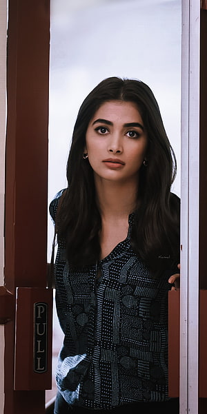 Priyanka Chopra standing in a doorway wearing a patterned black top HD phone wallpaper