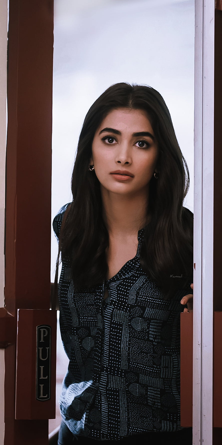 Priyanka Chopra standing in a doorway wearing a patterned black top HD phone wallpaper