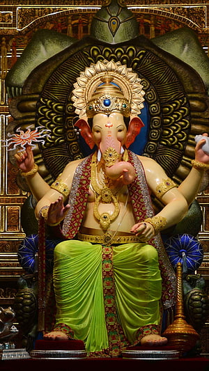 Ganesha Statue in Green Dhoti with Golden Crown and Jewelry HD phone wallpaper