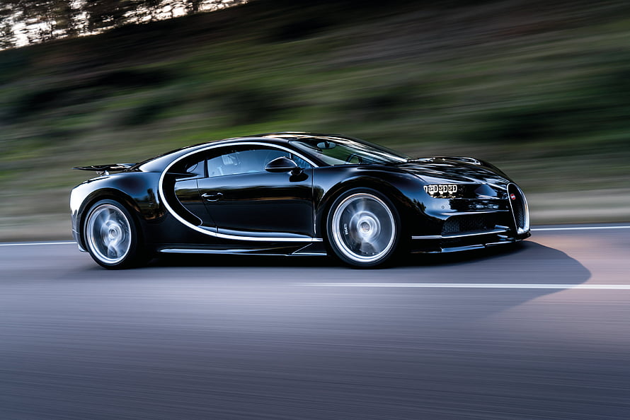 Black Bugatti Chiron Super Sport in Motion on a Scenic Road HD wallpaper