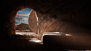 Empty Tomb of Jesus with Rolled Stone and Crosses in the Distance HD wallpaper