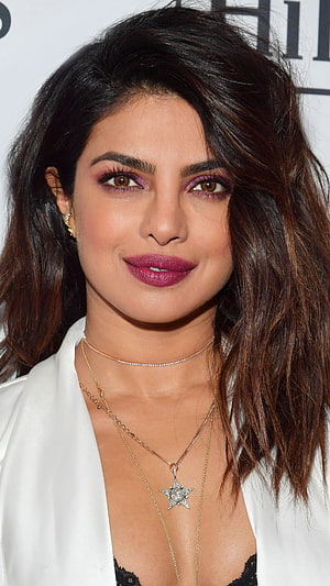 Priyanka Chopra in White Blazer with Star Necklace and Bold Purple Makeup HD phone wallpaper