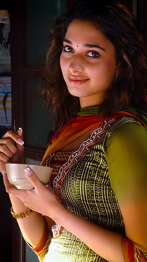 Tamannaah Bhatia in Green and Orange Traditional Outfit Holding Bowl, Tamanna Bhatia, telugu actress HD phone wallpaper