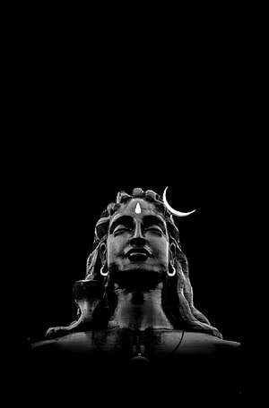 Serene Black and White Portrait of Lord Shiva Statue with Crescent Moon HD phone wallpaper