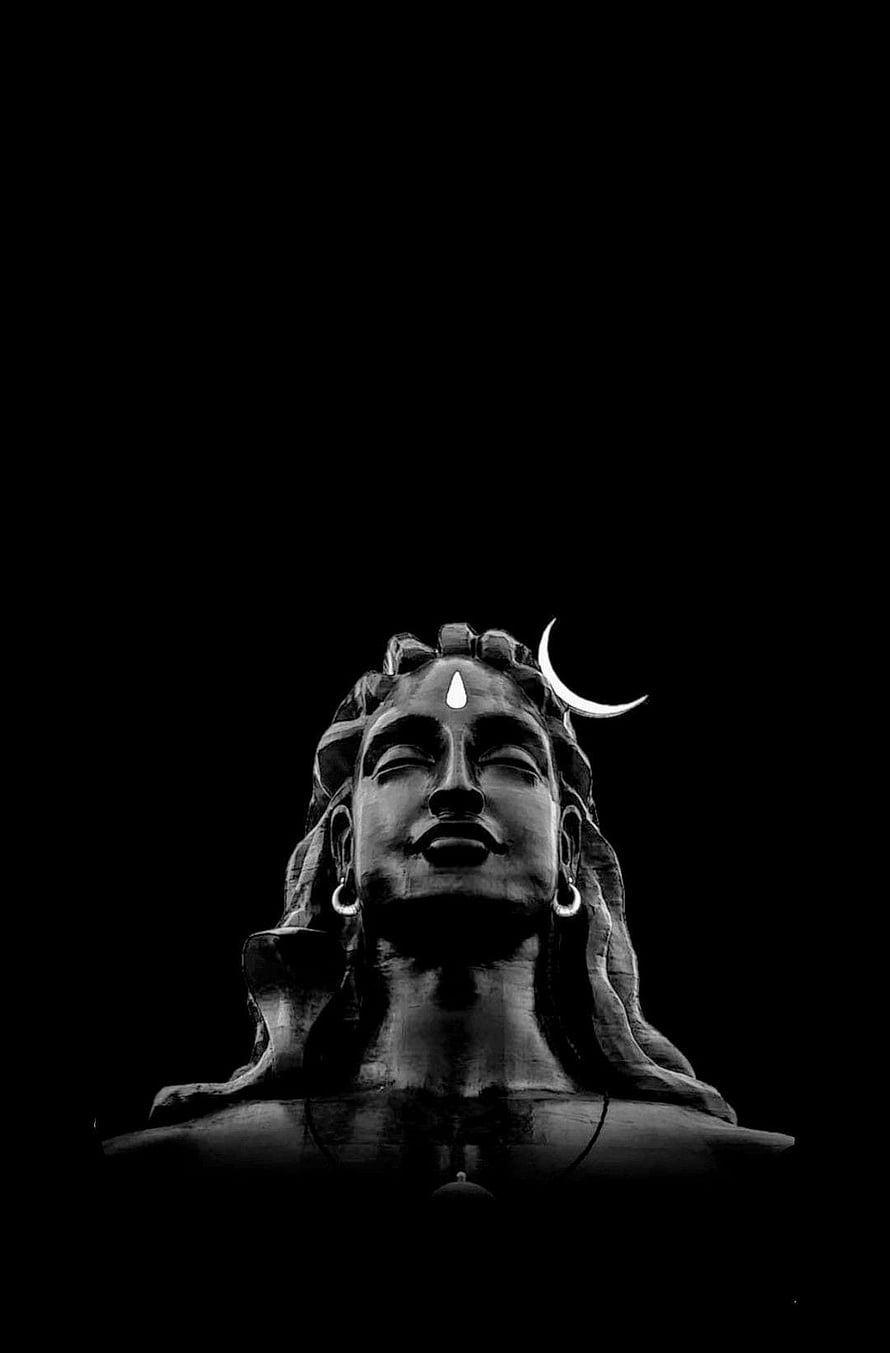 Serene Black and White Portrait of Lord Shiva Statue with Crescent Moon HD phone wallpaper