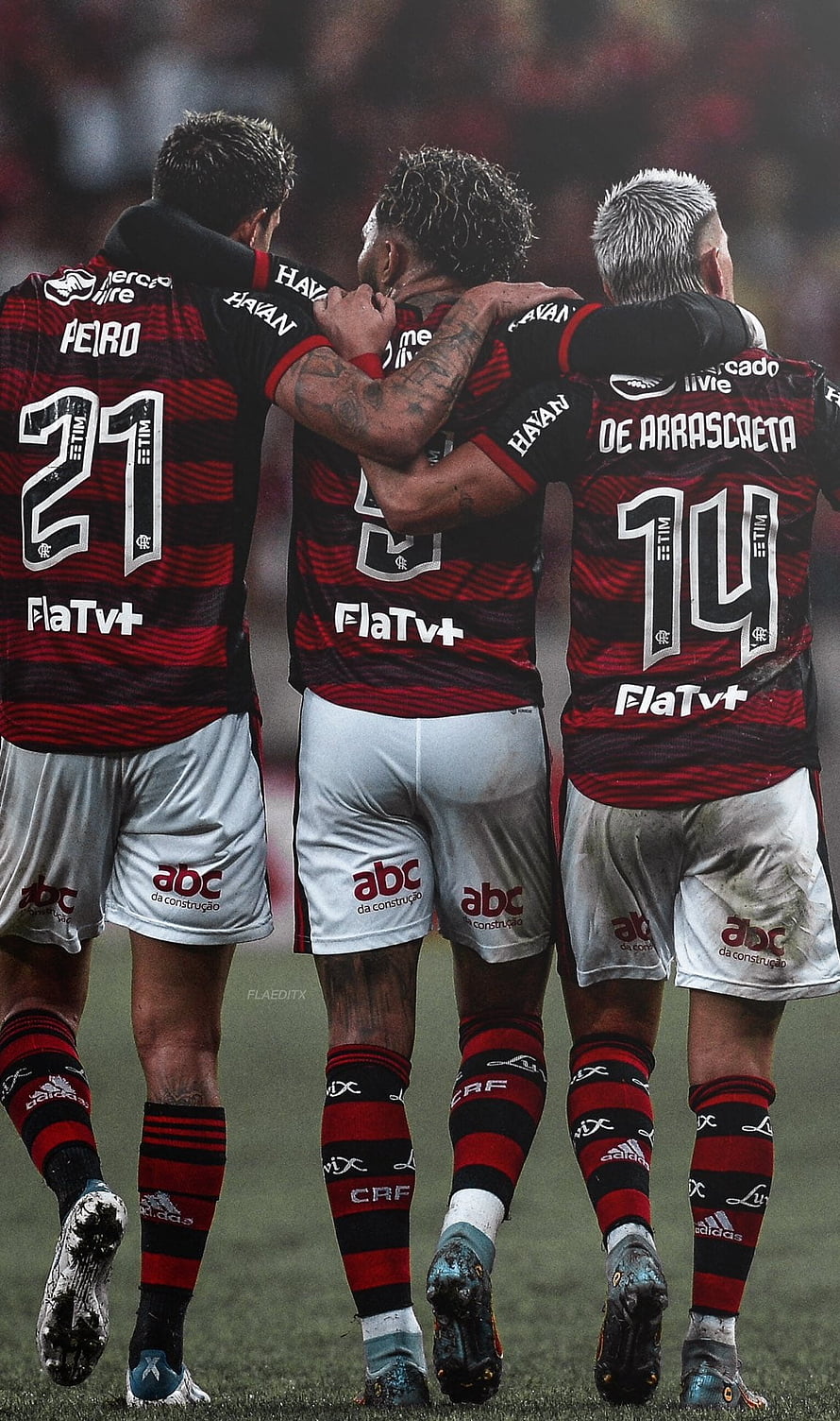 Flamengo players Pedro, De Arrascaeta, and Gabigol celebrating together on the pitch in red and black striped jerseys HD phone wallpaper