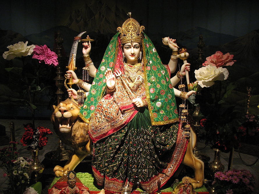 Vaishno Devi Mata Ji Murti with Lion and Traditional Offerings HD wallpaper