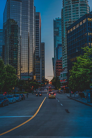 Downtown San Francisco street view at dusk with modern skyscrapers and city traffic HD phone wallpaper