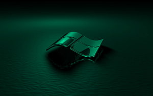 Glossy Green Windows Logo Floating on Dark Water Surface HD wallpaper
