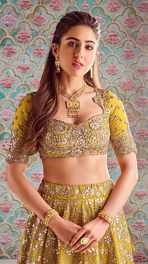 Saiyami Kher in a stunning yellow embroidered lehenga choli with traditional gold jewelry HD phone wallpaper