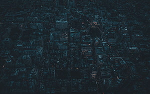 Aerial View of a Dark City at Night with Blue Tint and Scattered Lights HD wallpaper