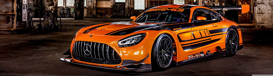 Orange Mercedes-AMG GT3 Race Car in Industrial Garage Setting HD wallpaper