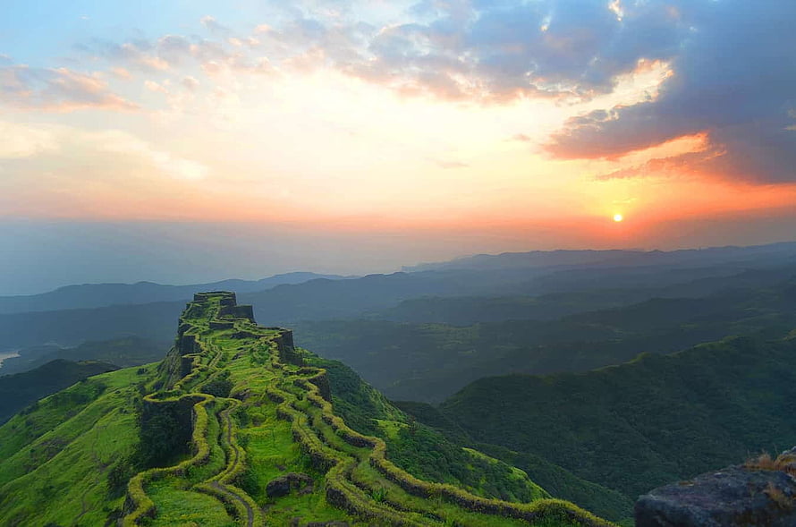 Rajgad Fort Sunrise Over Lush Green Mountain Ridges and Rolling Hills HD wallpaper