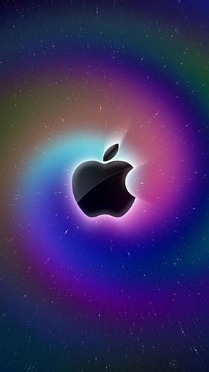 Apple Logo Glowing Against Vibrant Cosmic Nebula and Starfield Background HD phone wallpaper