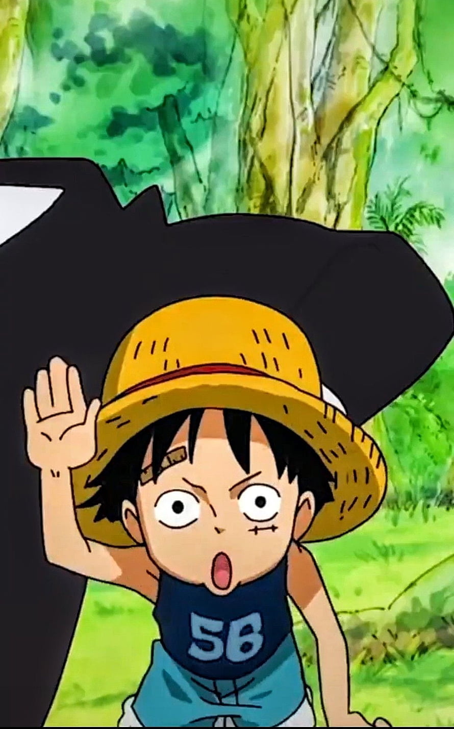 Young Monkey D. Luffy Waving in a Lush Green Forest from One Piece HD phone wallpaper