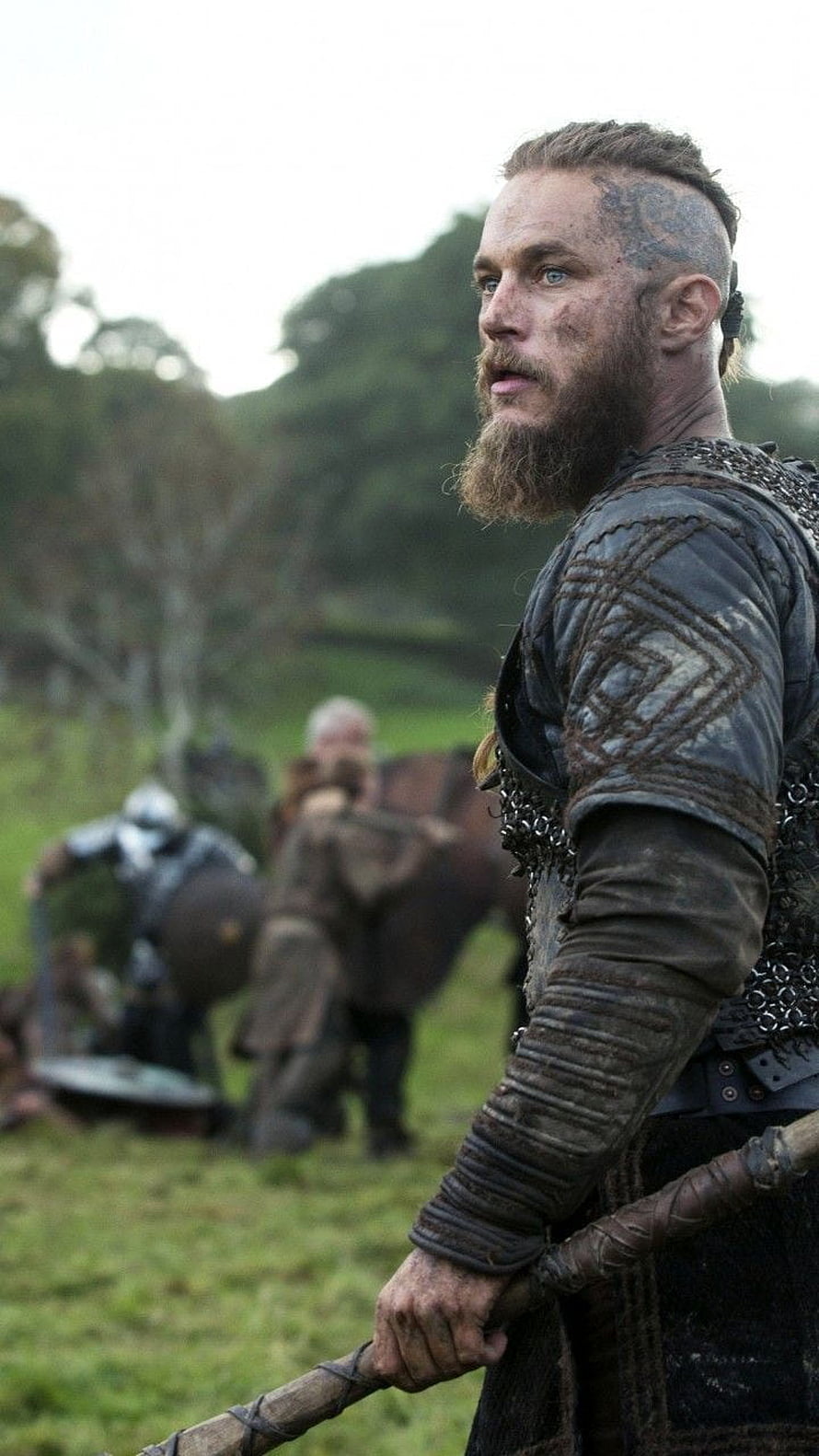 Ragnar Lothbrok in Viking Armor Holding a Spear on a Battle Field HD phone wallpaper