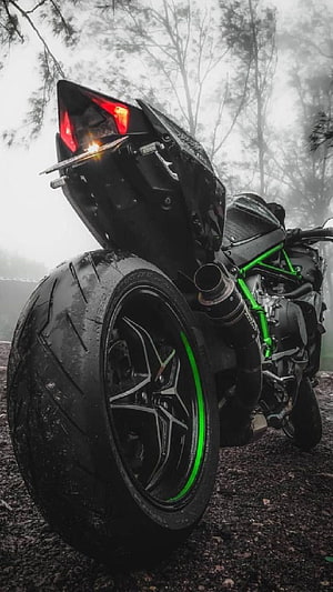 Black Kawasaki Ninja Superbike with Green Frame in Foggy Forest HD phone wallpaper