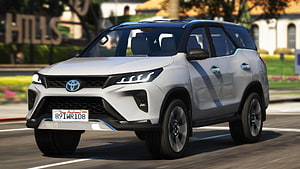 White Toyota Fortuner SUV Driving on City Street in Video Game HD wallpaper