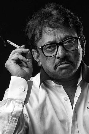 Portrait of Indian Filmmaker Anurag Kashyap Smoking a Cigarette in Black and White HD phone wallpaper