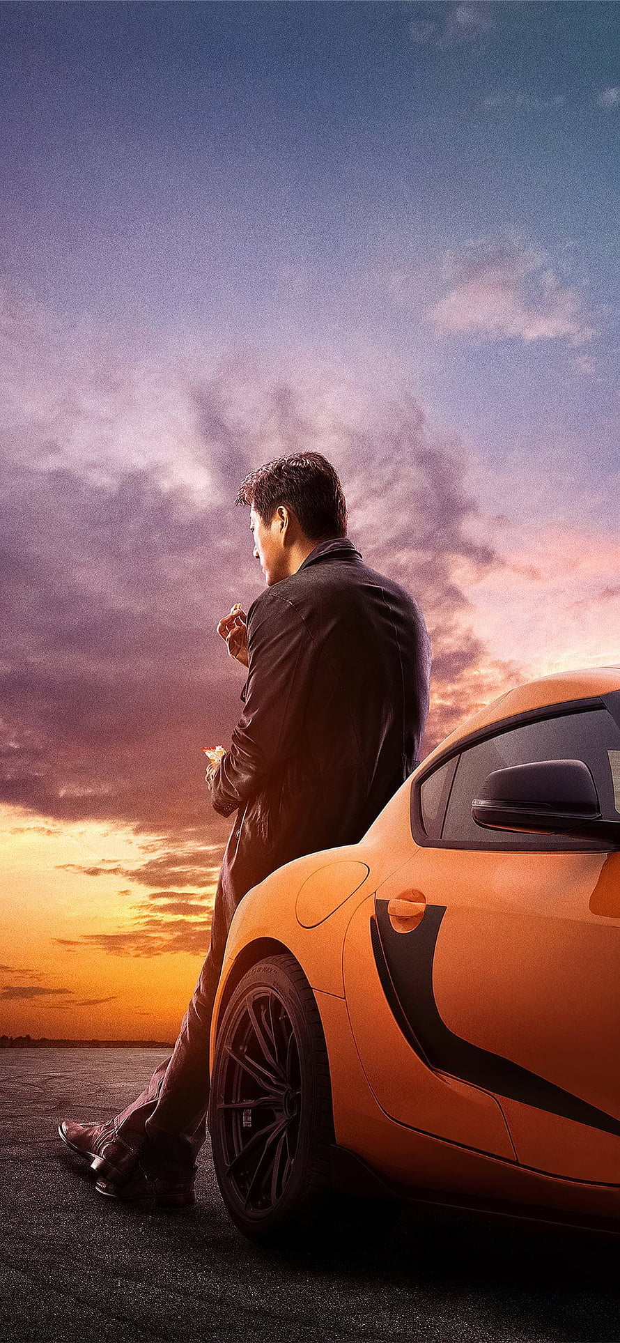 Han Lue Leaning Against Orange Supercar at Sunset in Fast and Furious 9 HD phone wallpaper