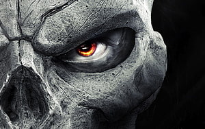 Close-up of a grey stone-like monster face with glowing red eye HD wallpaper