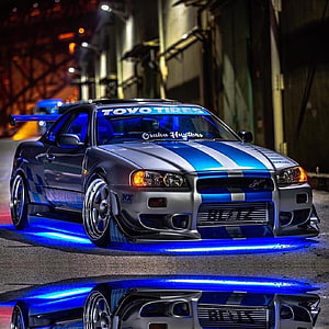 Silver and Blue Nissan Skyline GT-R R34 with Underglow at Night HD phone wallpaper