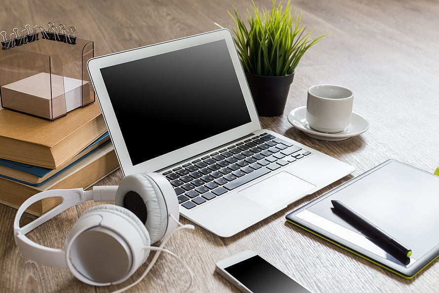 Modern Workspace Setup With Laptop, Headphones, Coffee, And Desk Accessories HD wallpaper
