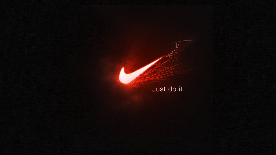 Glowing Red Nike Swoosh Logo with Electric Sparks on Dark Background HD wallpaper