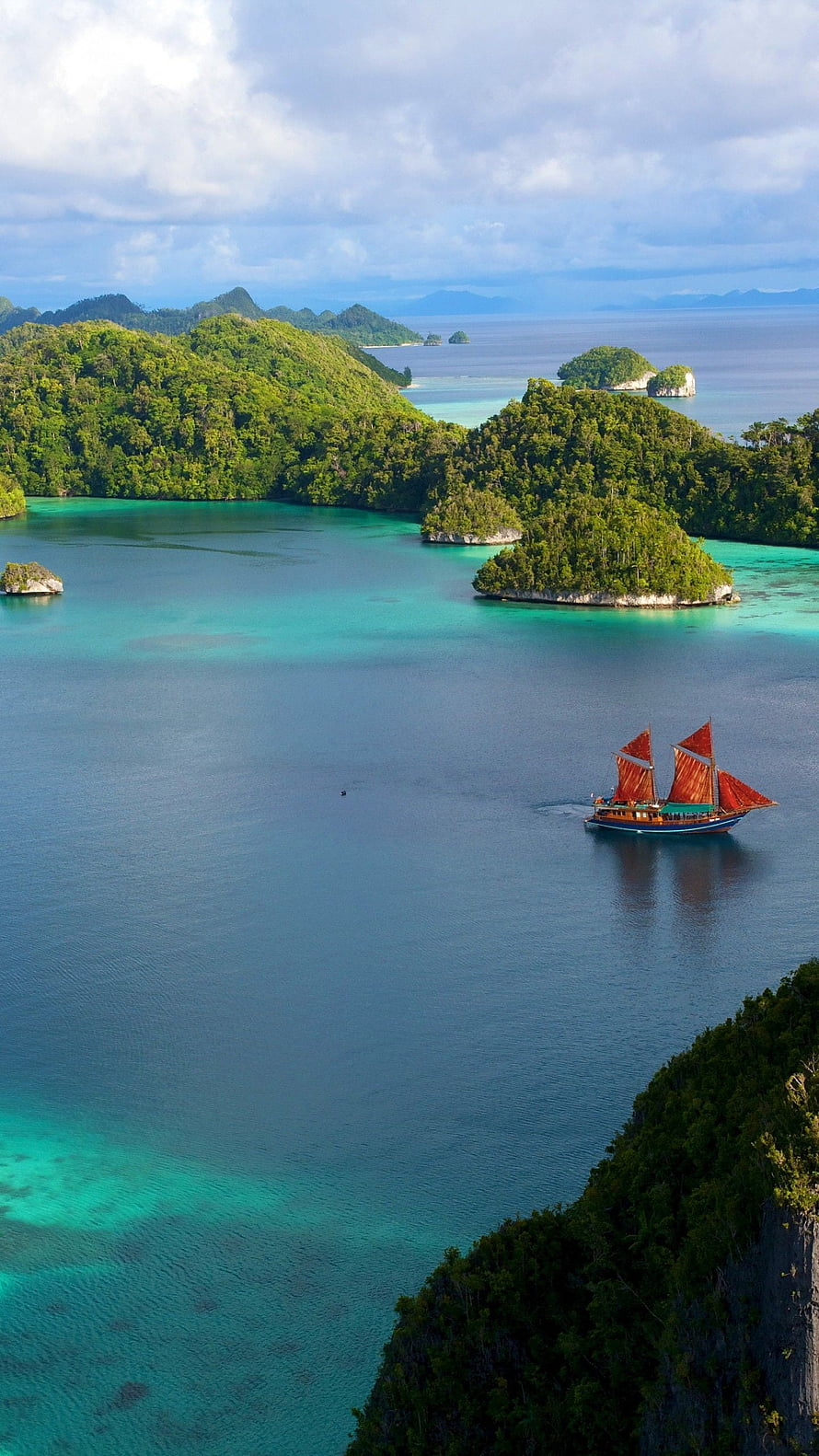 Traditional Phinisi Sailboat Cruising Through Turquoise Waters of Raja Ampat Indonesia HD phone wallpaper