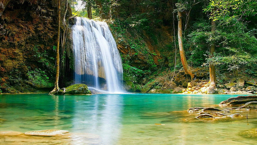 Serene Waterfall Cascading Into Turquoise Pool In Lush Tropical Forest HD wallpaper