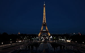 Eiffel Tower Illuminated at Night in Paris France with Trocadero Fountains and City Lights HD wallpaper
