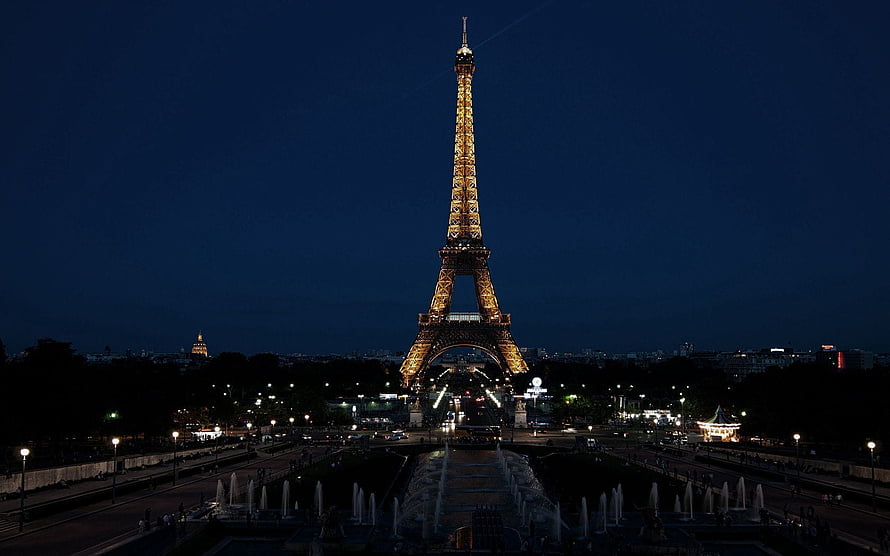 Eiffel Tower Illuminated at Night in Paris France with Trocadero Fountains and City Lights HD wallpaper