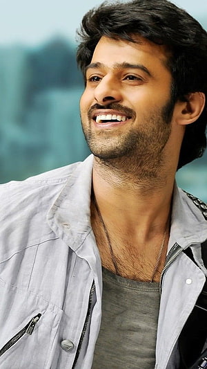 Parineethi Master smiling portrait wearing a grey jacket and necklace HD phone wallpaper