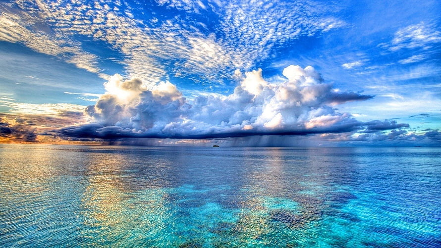 Stunning Ocean View With Dramatic Clouds And Turquoise Waters HD wallpaper