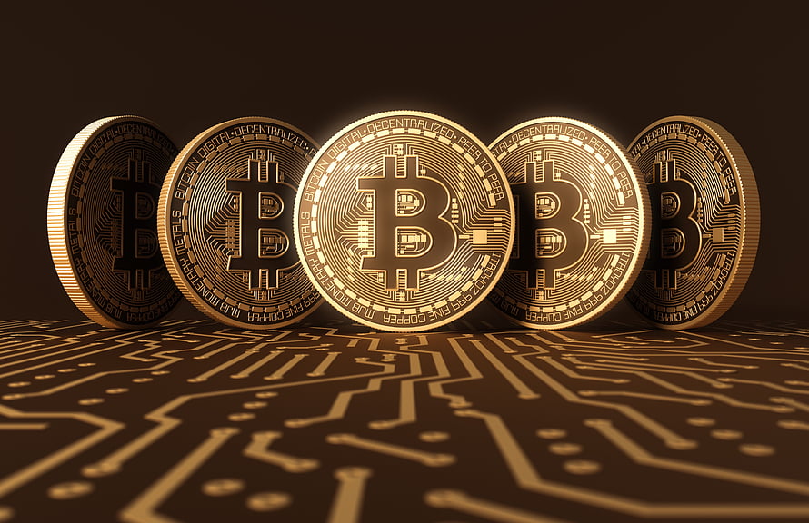 Five Golden Bitcoin Coins Standing on a Circuit Board with Digital Technology Theme HD wallpaper