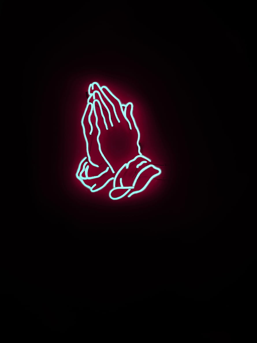 Glowing Cyan Neon Praying Hands Sign on Black Background HD phone wallpaper