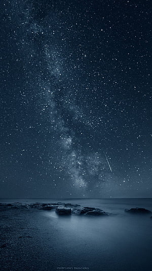 Stunning Milky Way Galaxy Over Calm Ocean With Shooting Star And Rocks HD phone wallpaper